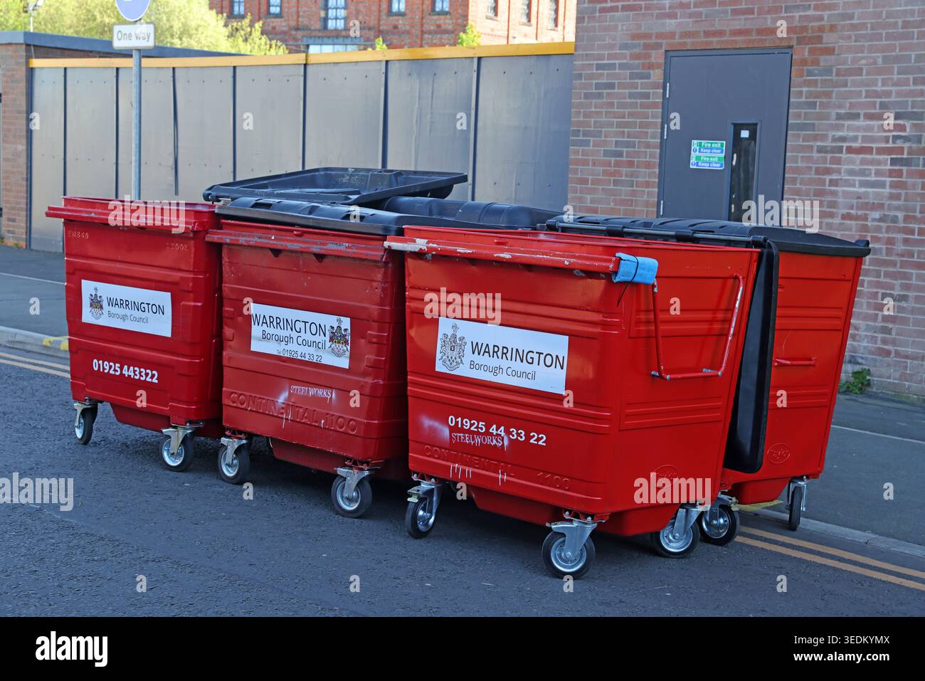 Warrington Red Waste Bins - Steelworks, Warrington, Cheshire, England, UK. Stock Photo