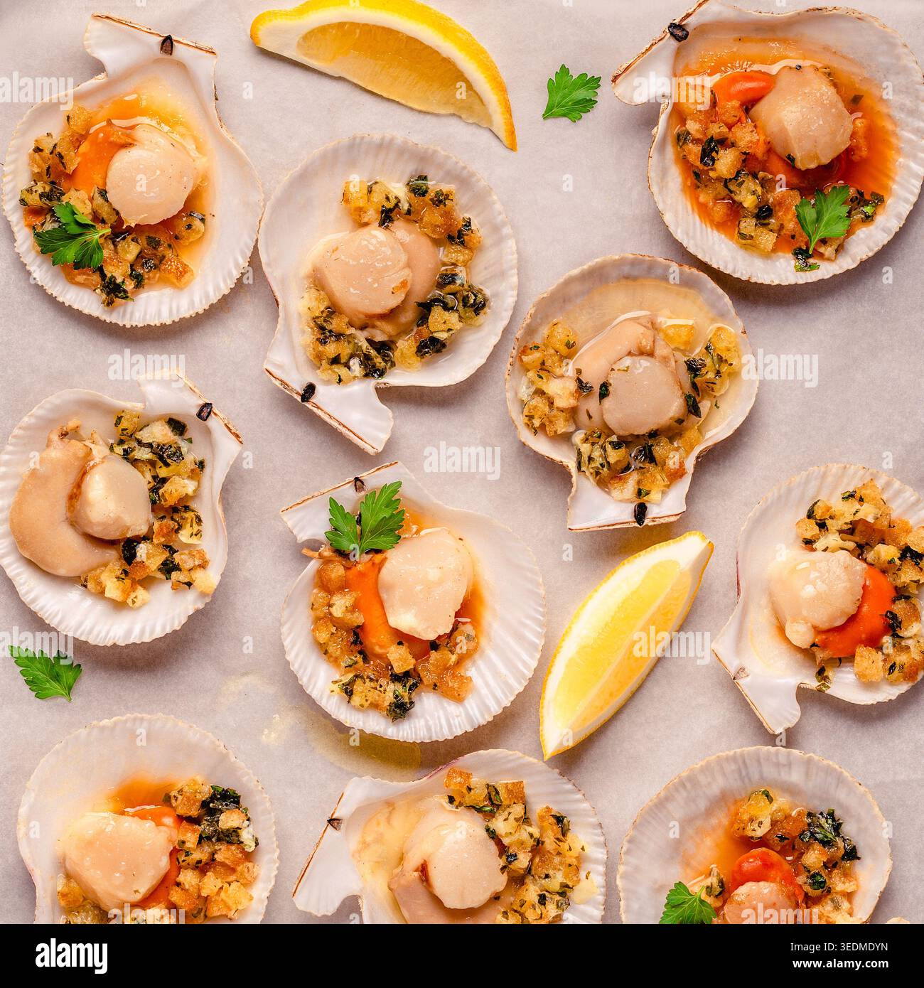 Cooked scallops with sauce on a baking sheet Stock Photo
