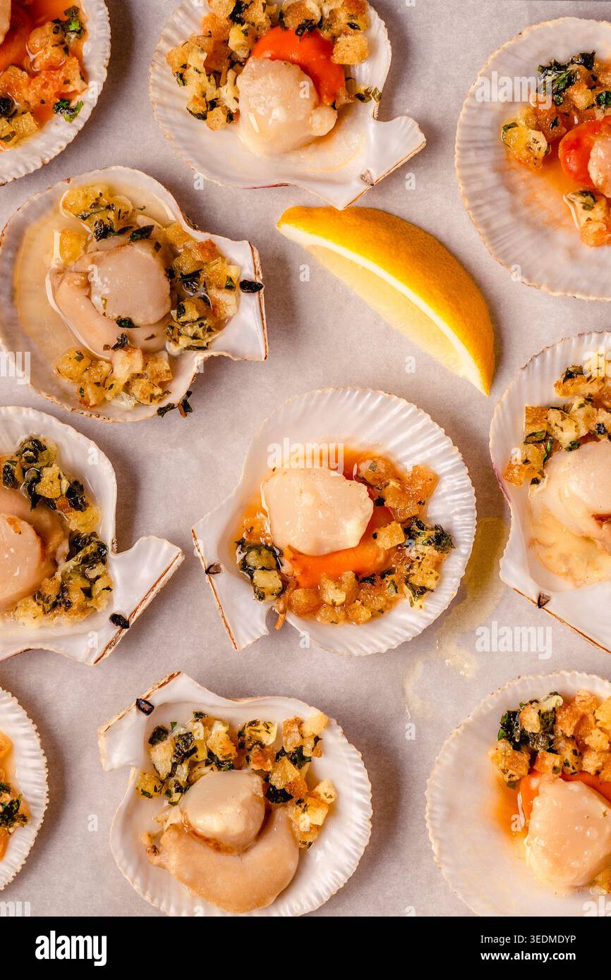 Cooked scallops with sauce on a baking sheet Stock Photo