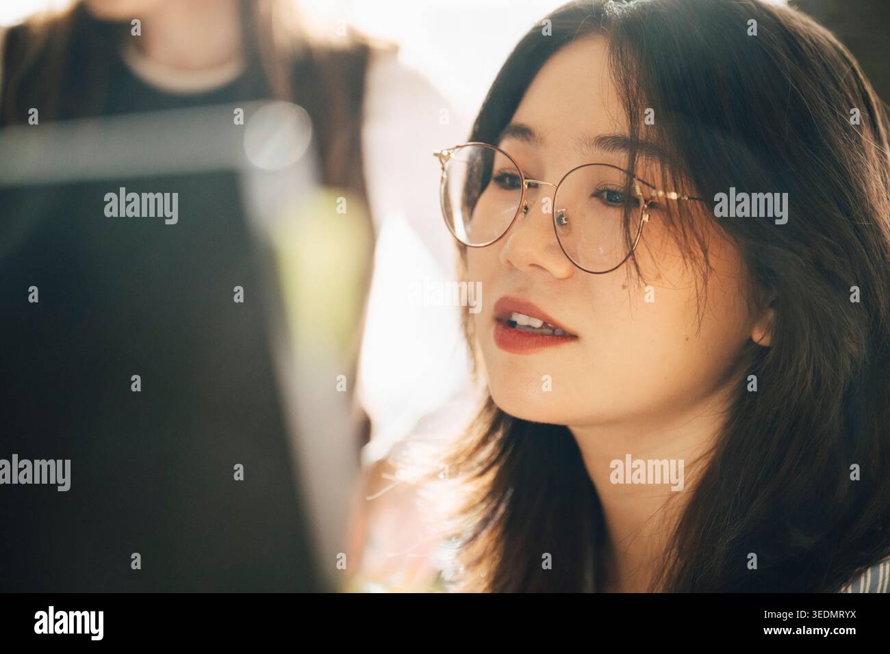 Close-up of female computer programmer working at office Stock Photo
