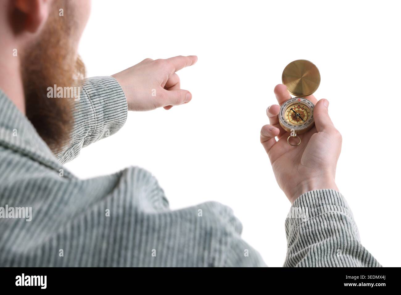 Man with compass pointing in direction on white background, closeup Stock Photo