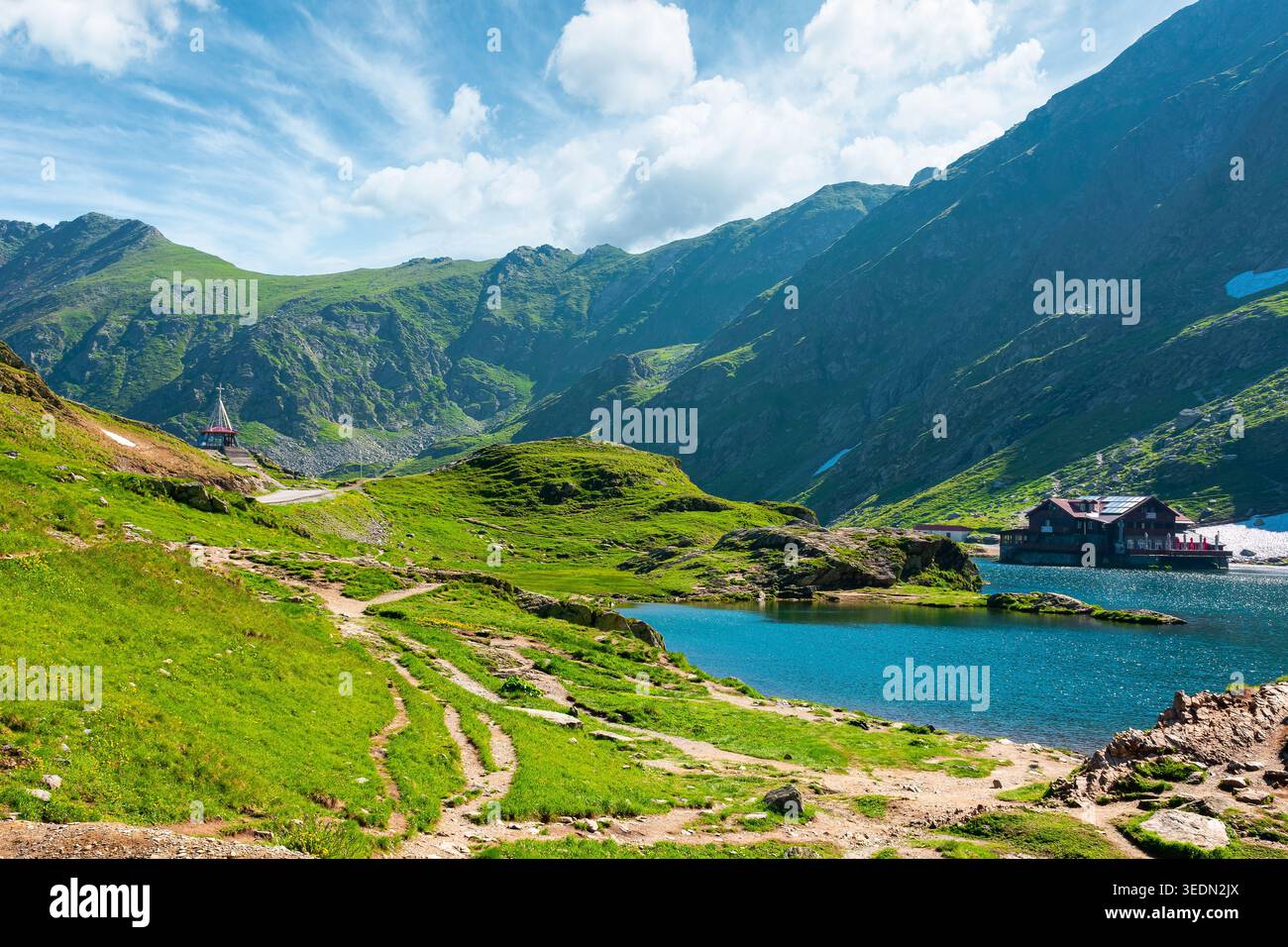 beautiful alpine scenery of fagaras mountains. balea lake in romania mountain landscape. summer weather with clouds on sky. view of rippled water near Stock Photo