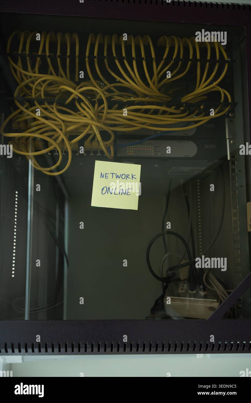 Network Online Confirmation Note on Professional Server Rack Stock Photo