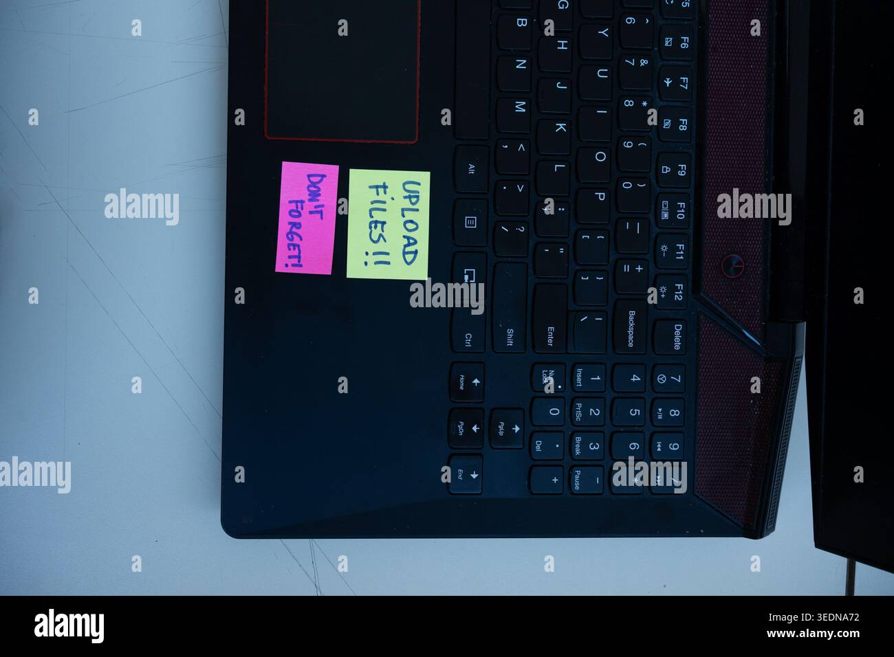Vertical Concept of Upload Files Reminder Notes on Laptop Stock Photo