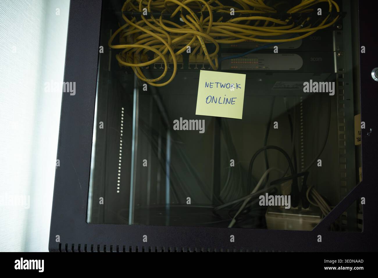 Network Online Confirmation Note on Professional Server Rack Stock Photo