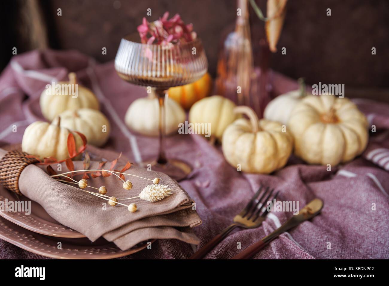 Elegant fall tablescape with pumpkins and seasonal decor Stock Photo