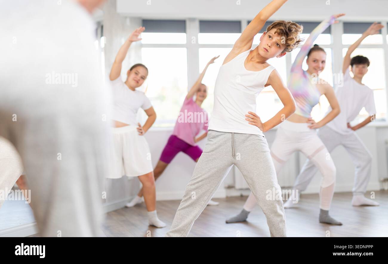 Group of children warming up before dance class Stock Photo