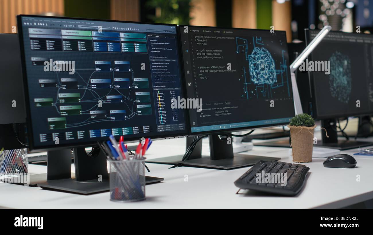 Computers in empty office used to implement machine learning algorithms to prevent AI errors. PC monitors in tech agency with software used to review code and improve artificial intelligence Stock Photo
