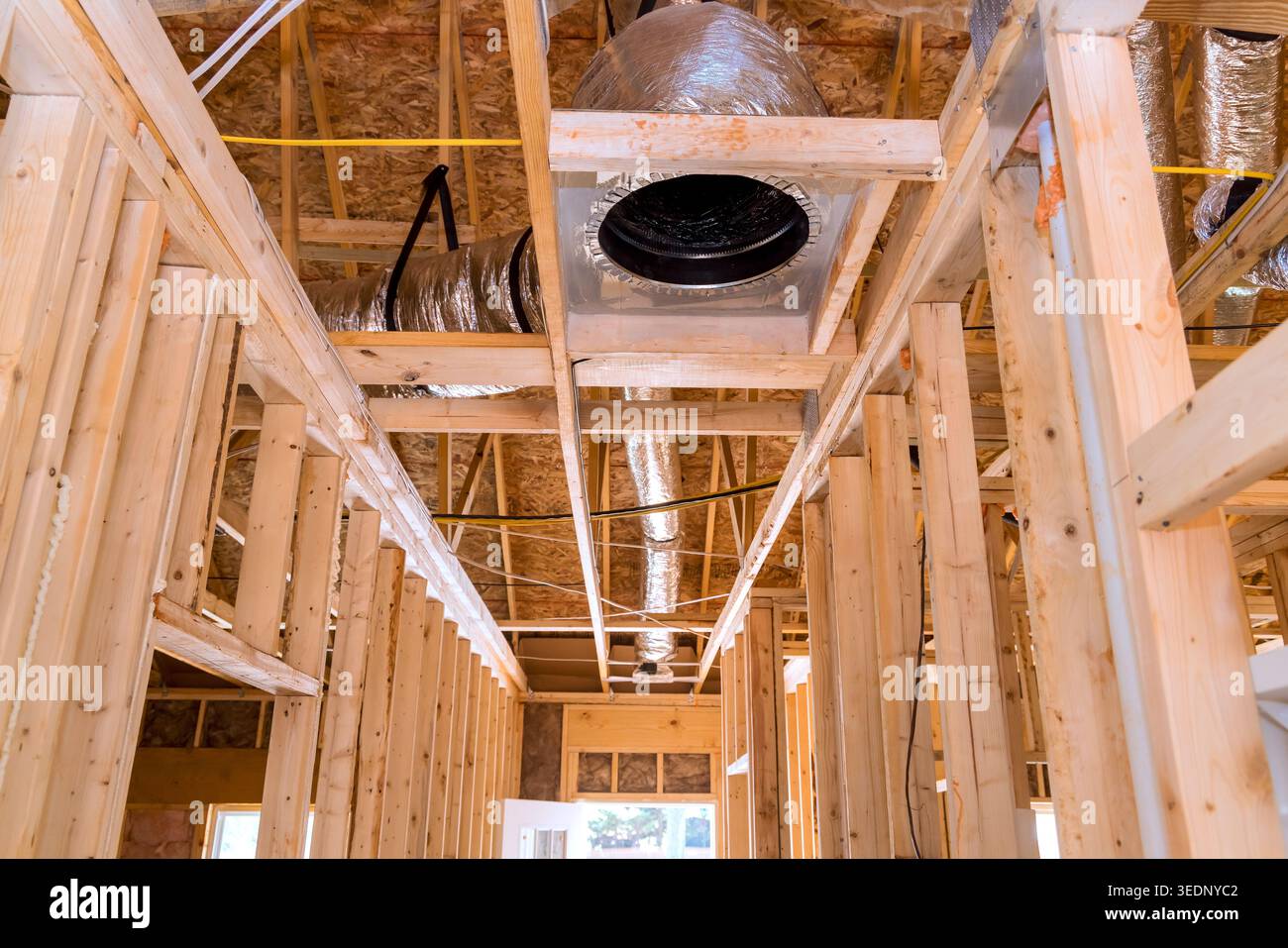 Workers are installing heating cooling systems in building that is being remodeled. Stock Photo