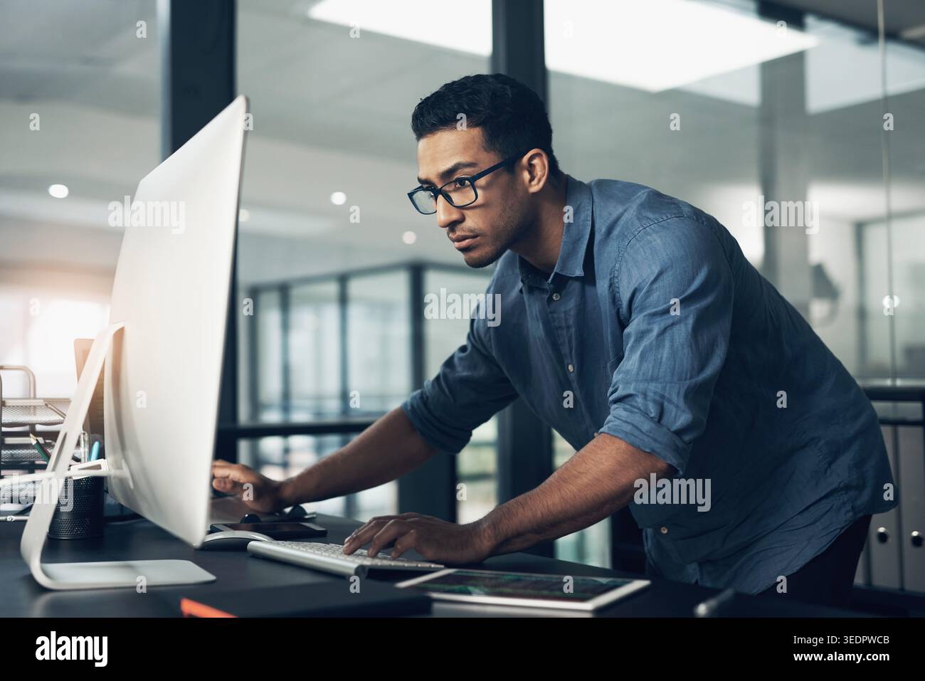 Coding, office and man on computer for programming, system upgrade and software design. Network, IT programmer and worker with pc for web development Stock Photo