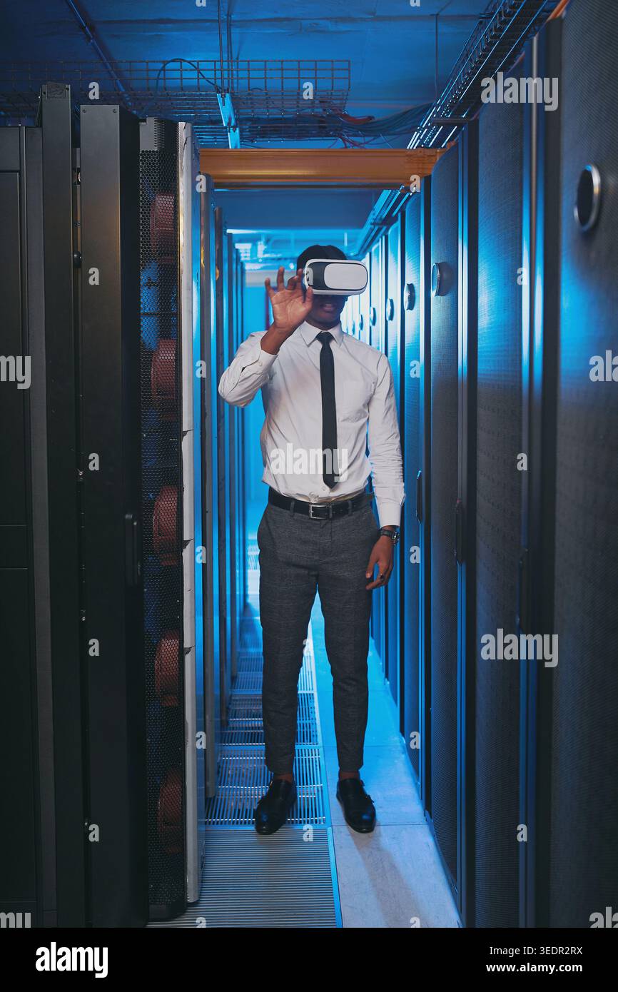 Man, inspection and vr glasses for programming in server room with cybersecurity, system test or iot hardware. Programmer, tech and app for augmented Stock Photo