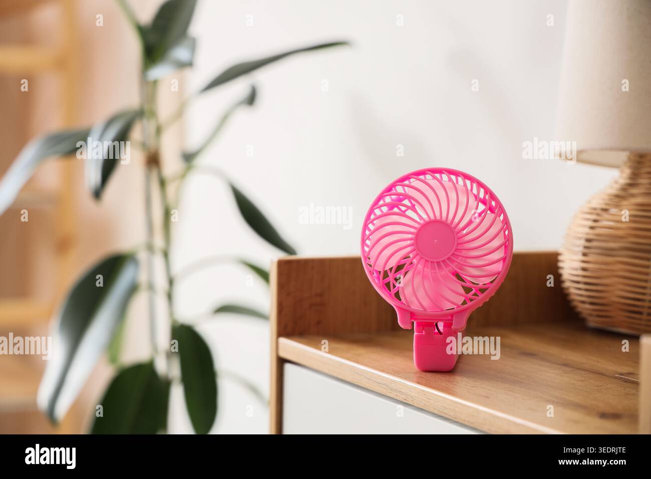Small electric fan on table Stock Photo