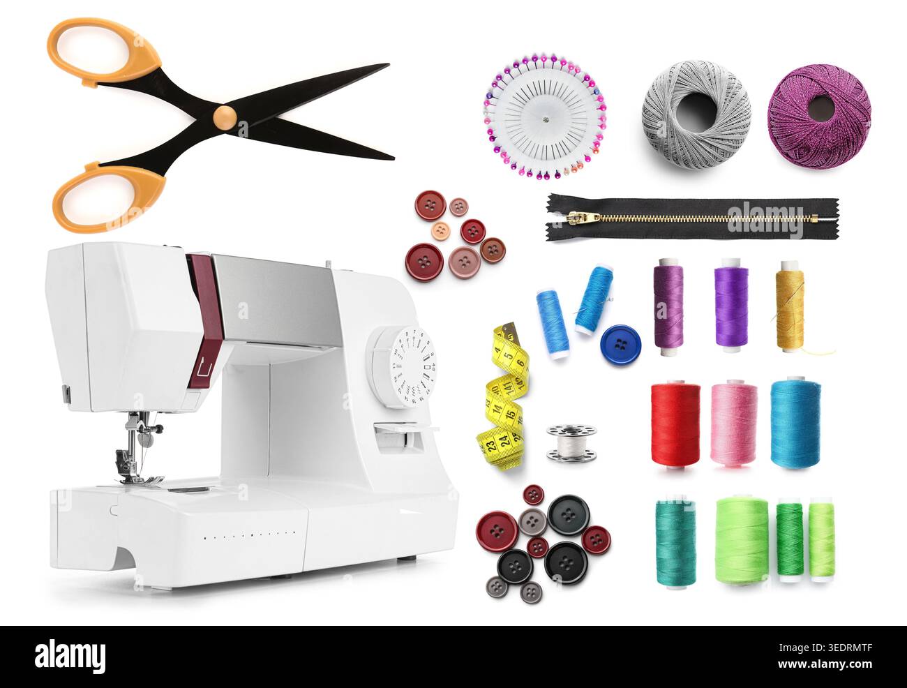 Sewing machine and different tailor's supplies on white background Stock Photo