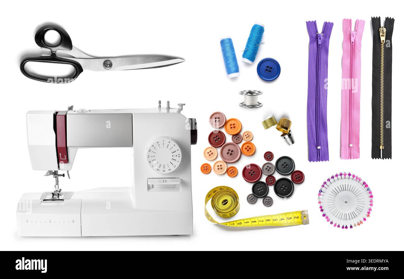 Sewing machine and different tailor's supplies on white background Stock Photo