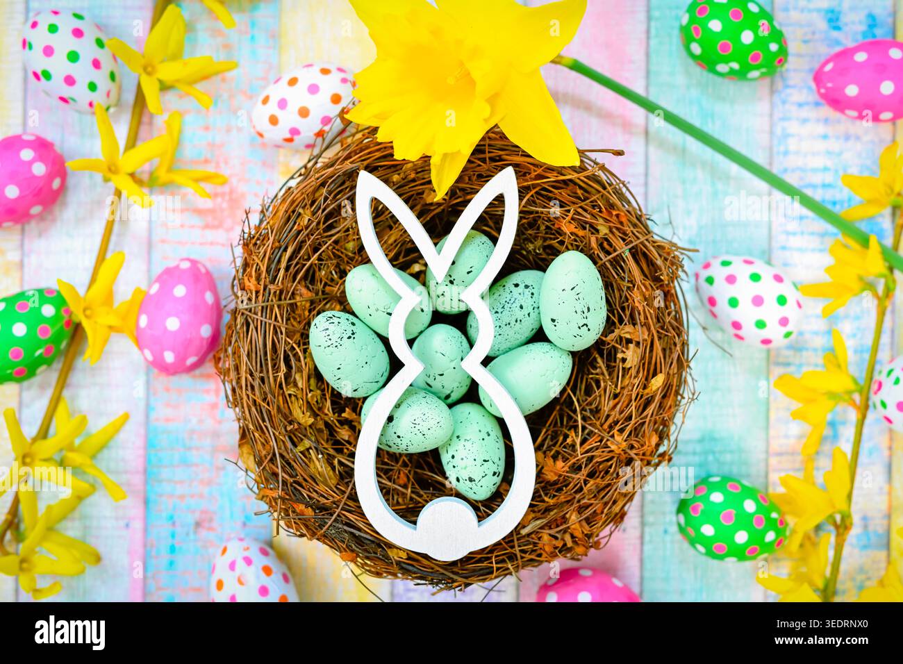Easter bunny in an Easter nest with Easter eggs Stock Photo