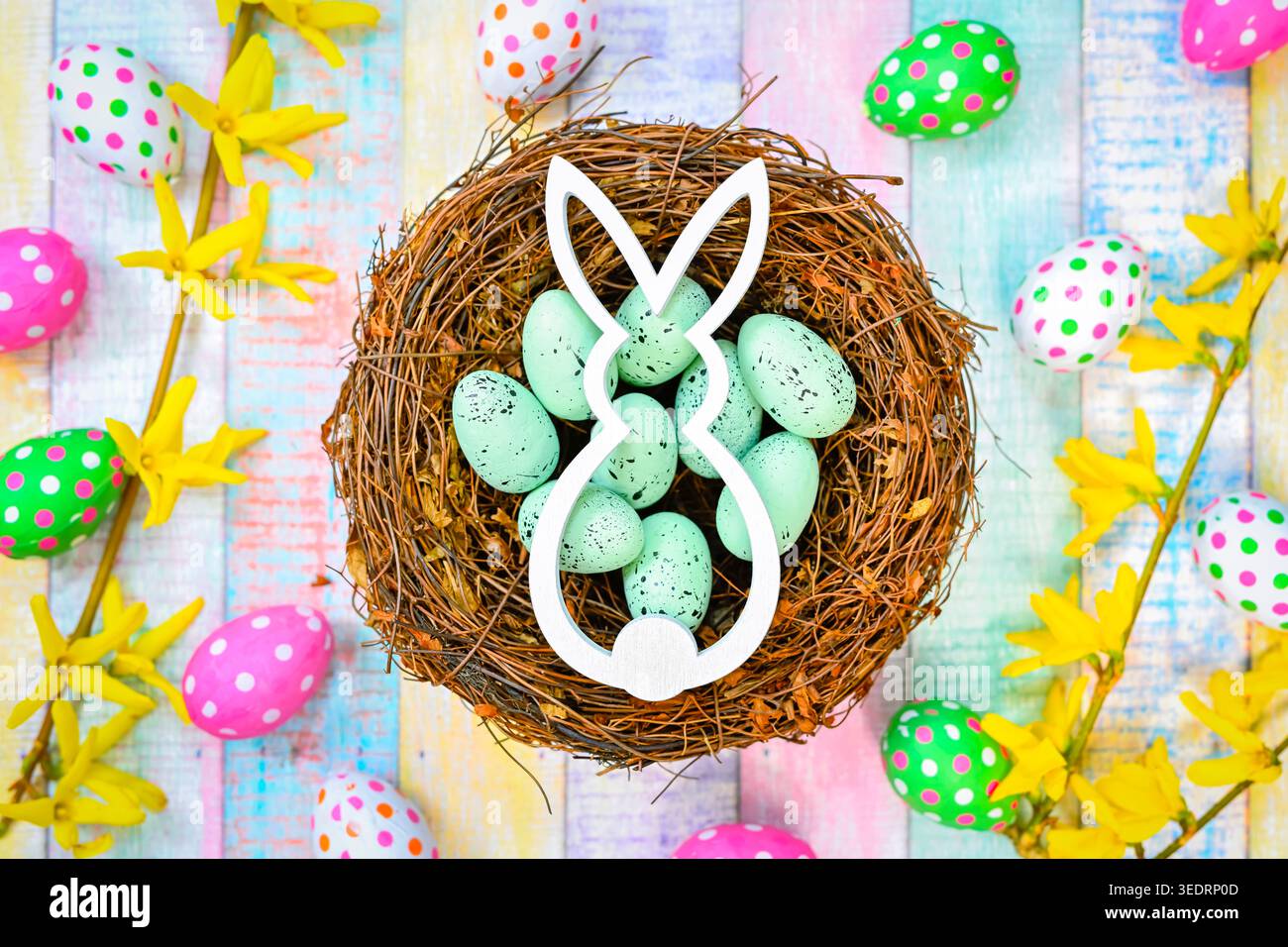 Easter bunny in an Easter nest with Easter eggs Stock Photo