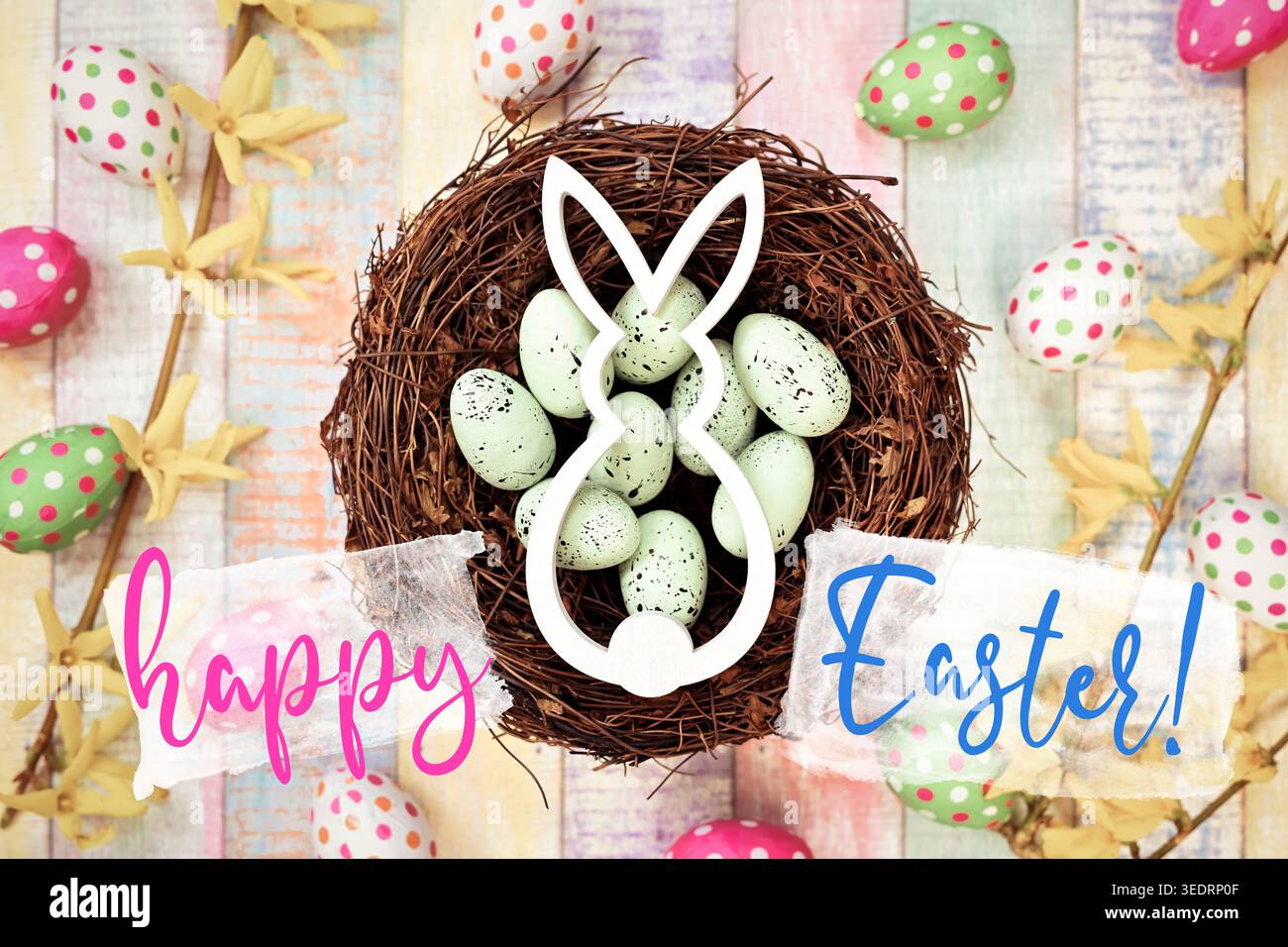 Easter bunny in Easter nest with Easter eggs and Easter greeting happy Easter, photomontage Stock Photo