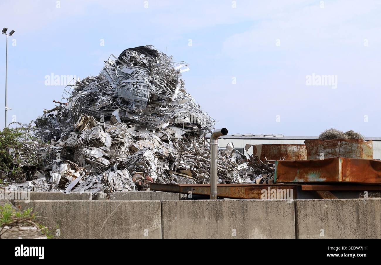 Recycle Metal Frame Stack Tall stack of aluminum and metallic material scraps in the outdoor ...