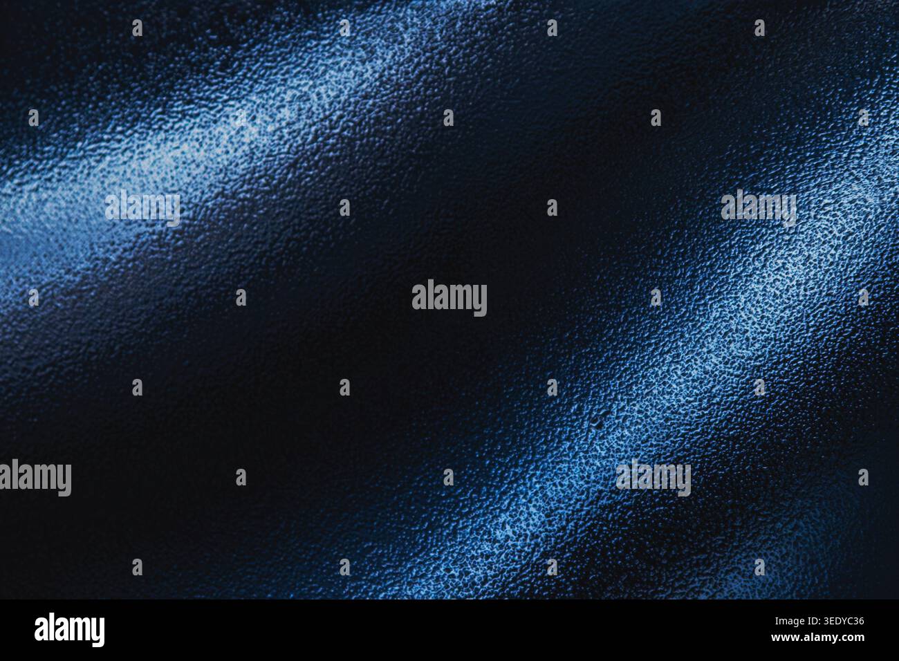 Abstract dark blue textured surface with diagonal light streaks Stock Photo