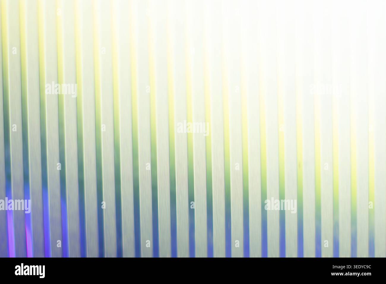 Bright vertical ribbed glass texture with glowing light leak effect Stock Photo