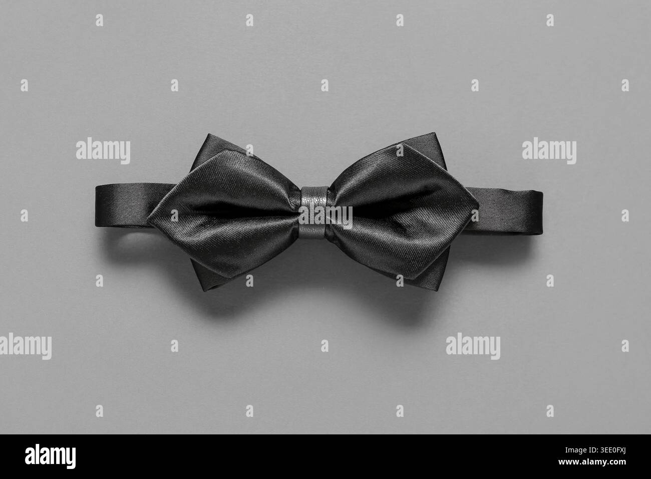 Stylish black bow tie on grey background Stock Photo