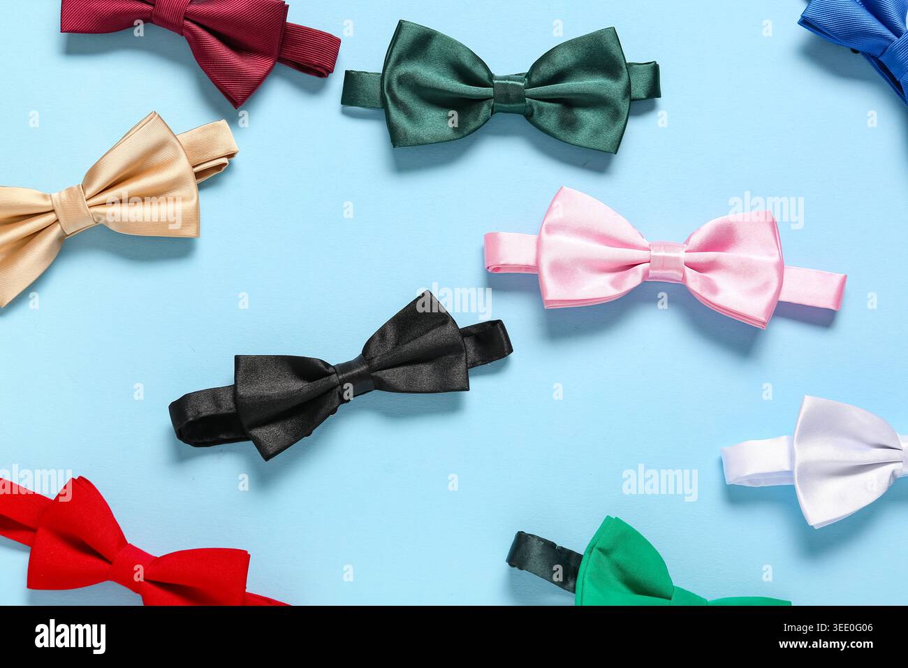Different stylish bow ties on blue background Stock Photo