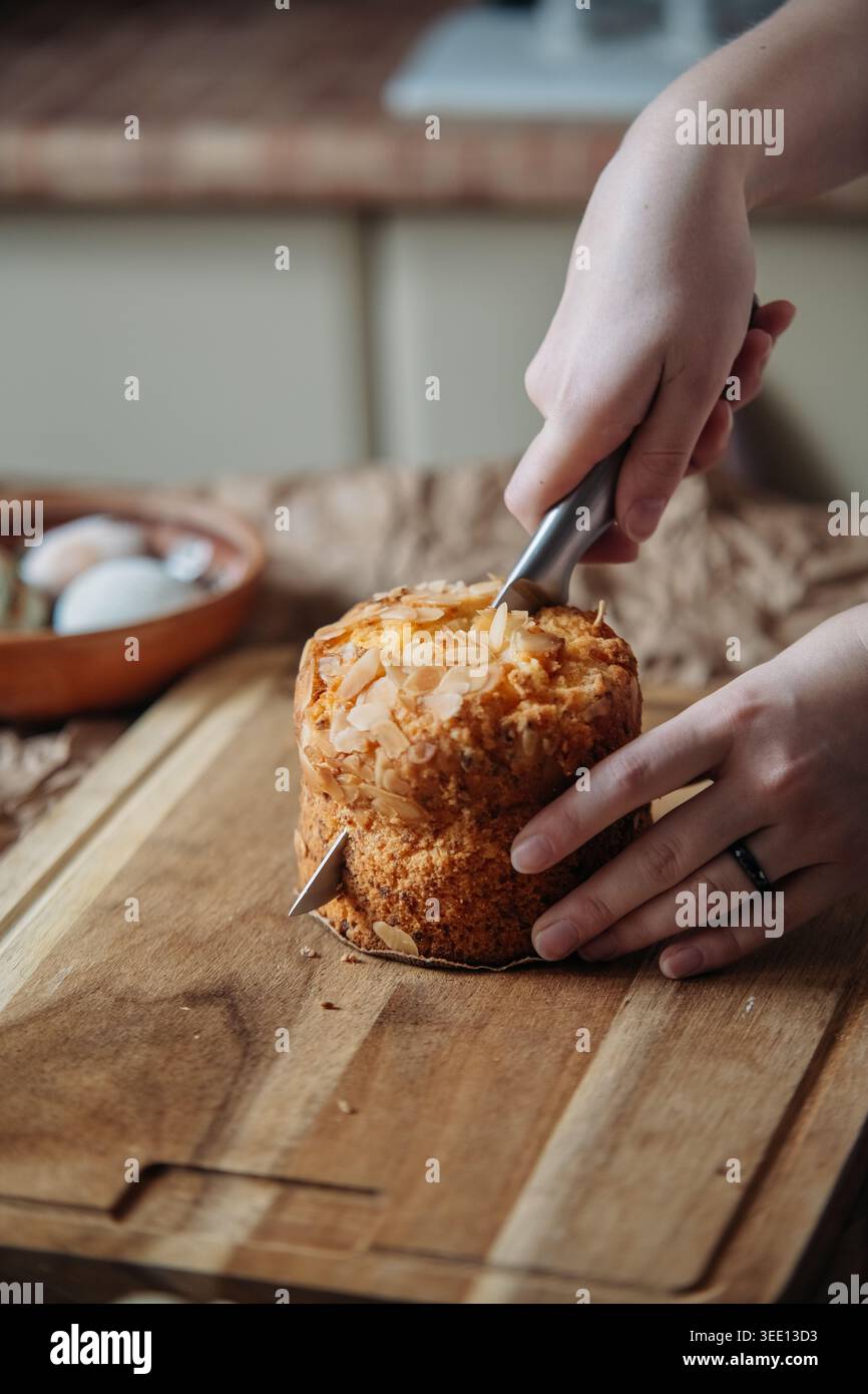 Cutting Easter Bread On Wooden Board Stock Photo