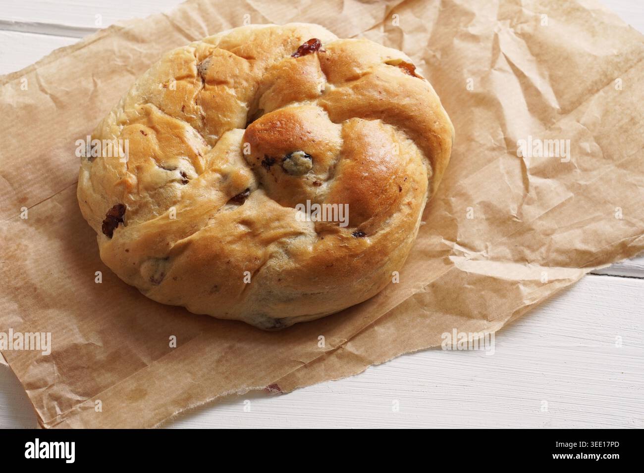 German raisin bread roll or currant bun Stock Photo
