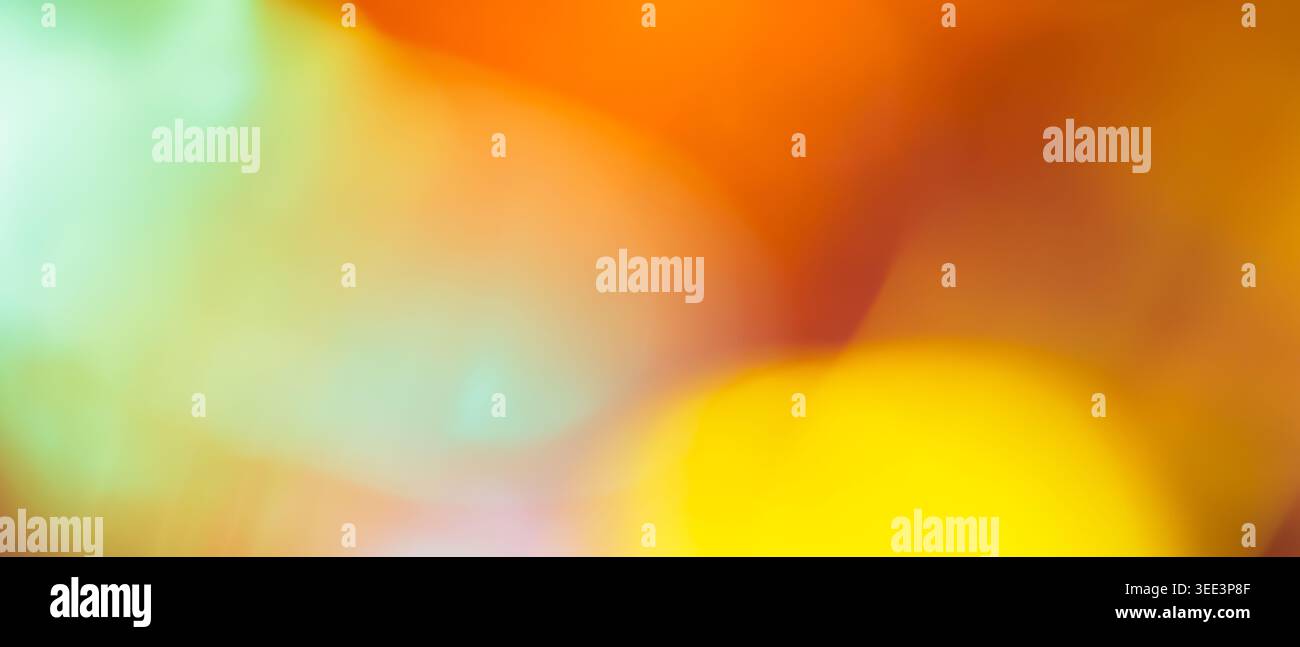 Vibrant abstract background with blurred orange yellow and mint green gradient and soft bokeh Stock Photo