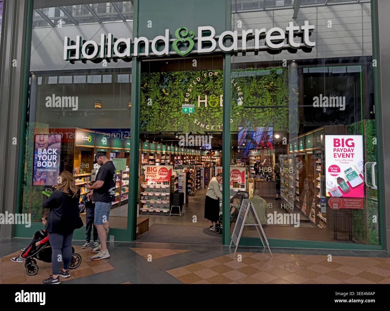 Holland & Barrett shopfront in Warrington Golden Square, part of the UK health food and supplements chain Stock Photo