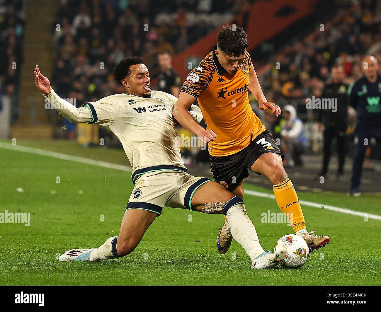 HULL, ENGLAND - MAY 8: Femi Azeez of Millwall FC tackles Ryan Giles of ...