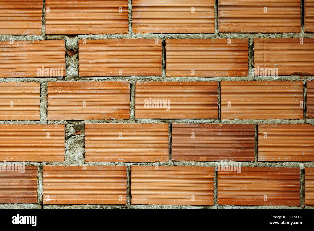 Newly Built Red Brick Wall Texture Background with Copy Space Stock Photo