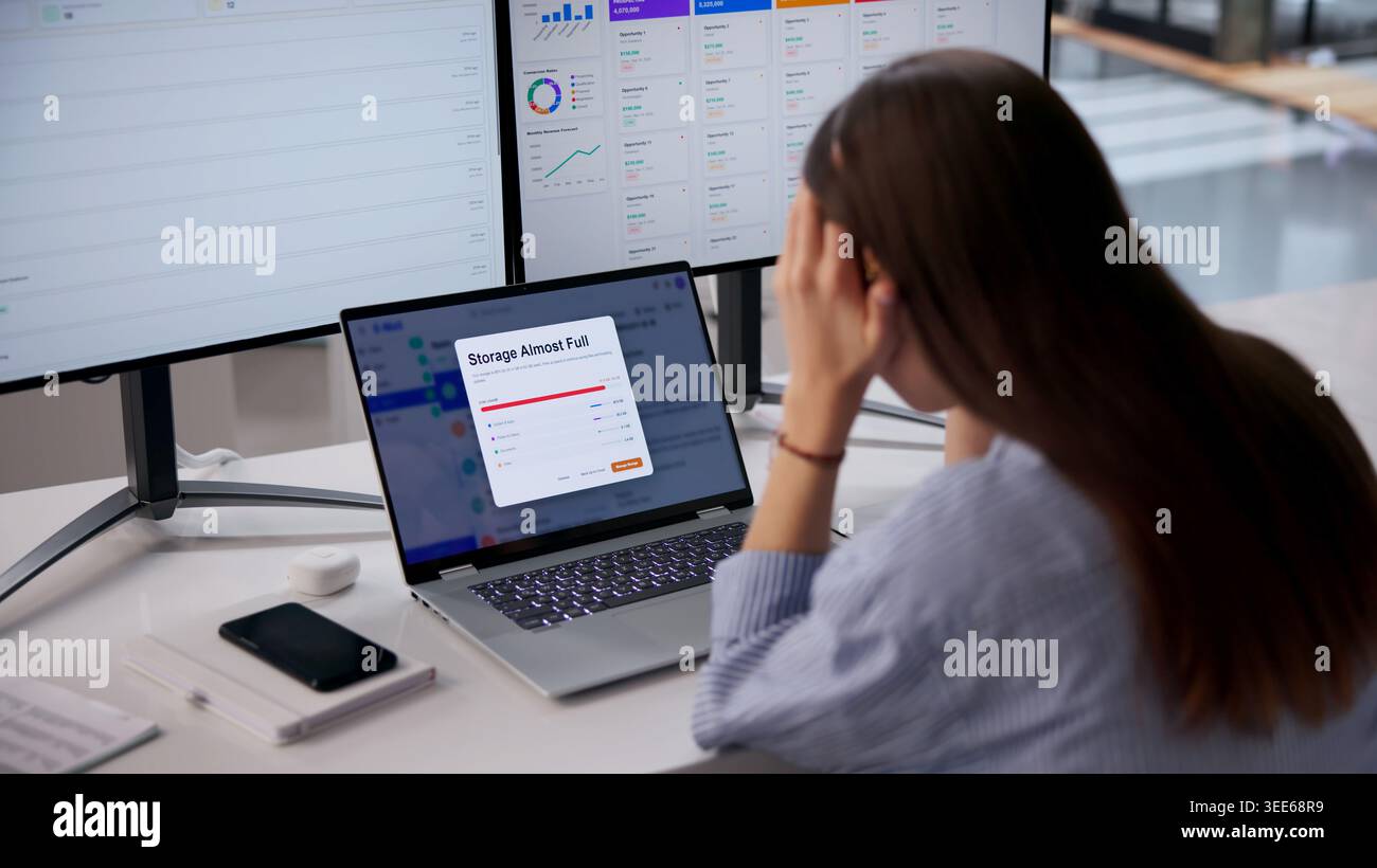 Woman Using Laptop Feels Stressed Facing Full Email Storage Problem. Stock Photo