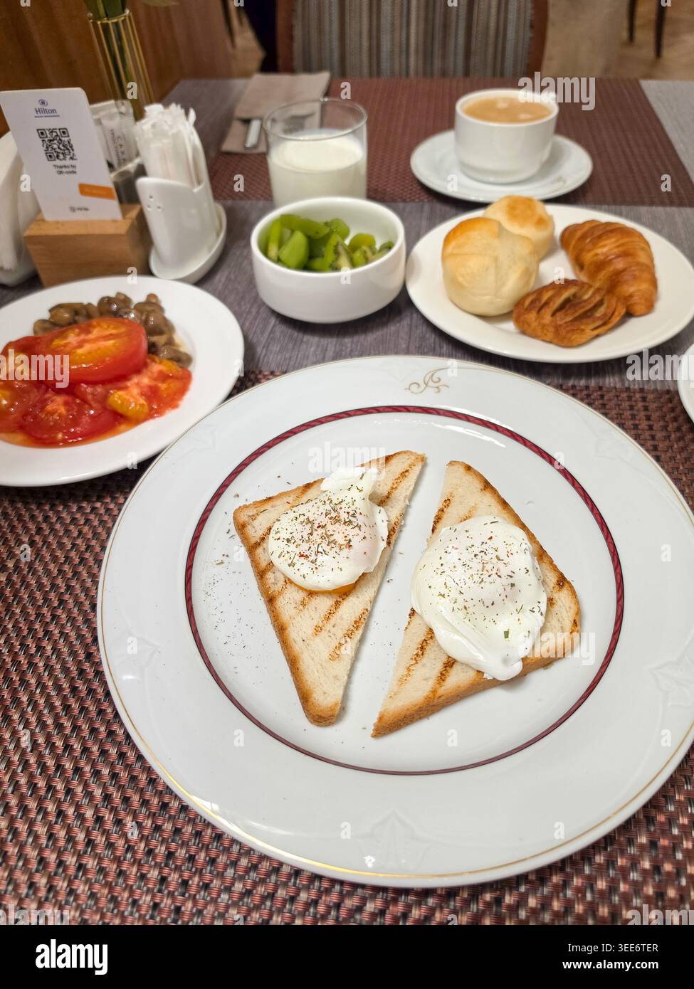 Breakfast with poached eggs on toasted bread Stock Photo