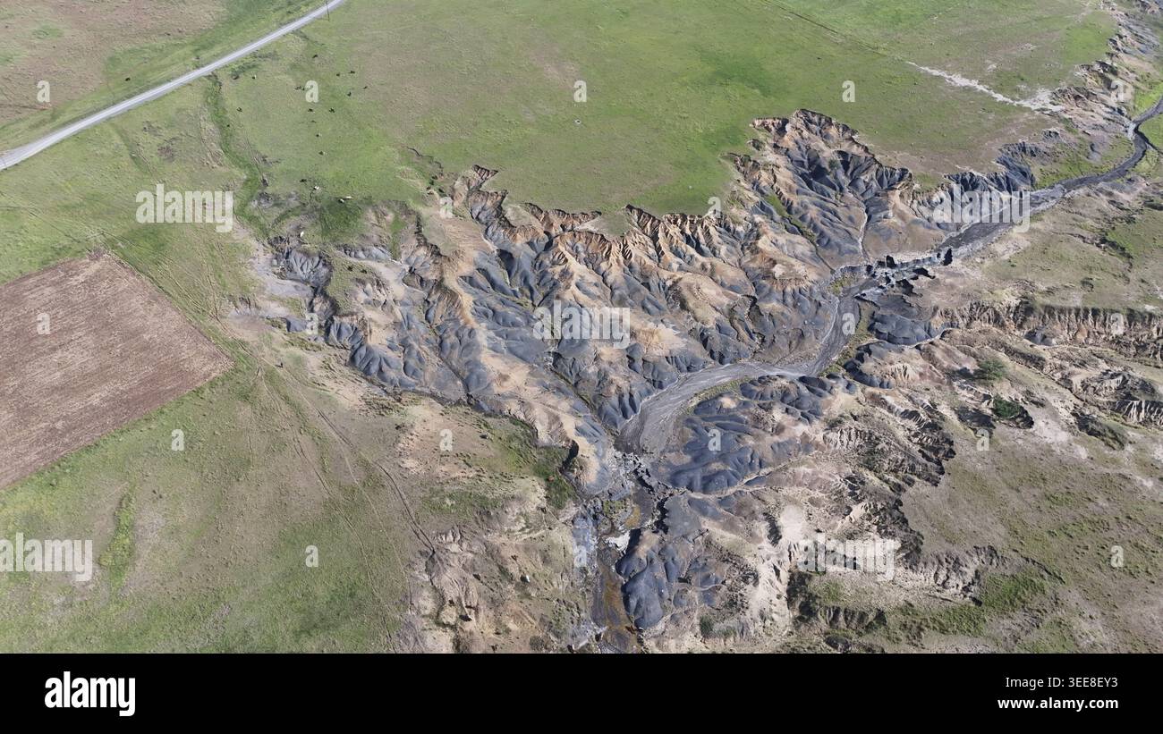 Aerial view of severe soil erosion and deep dongas cutting through ...
