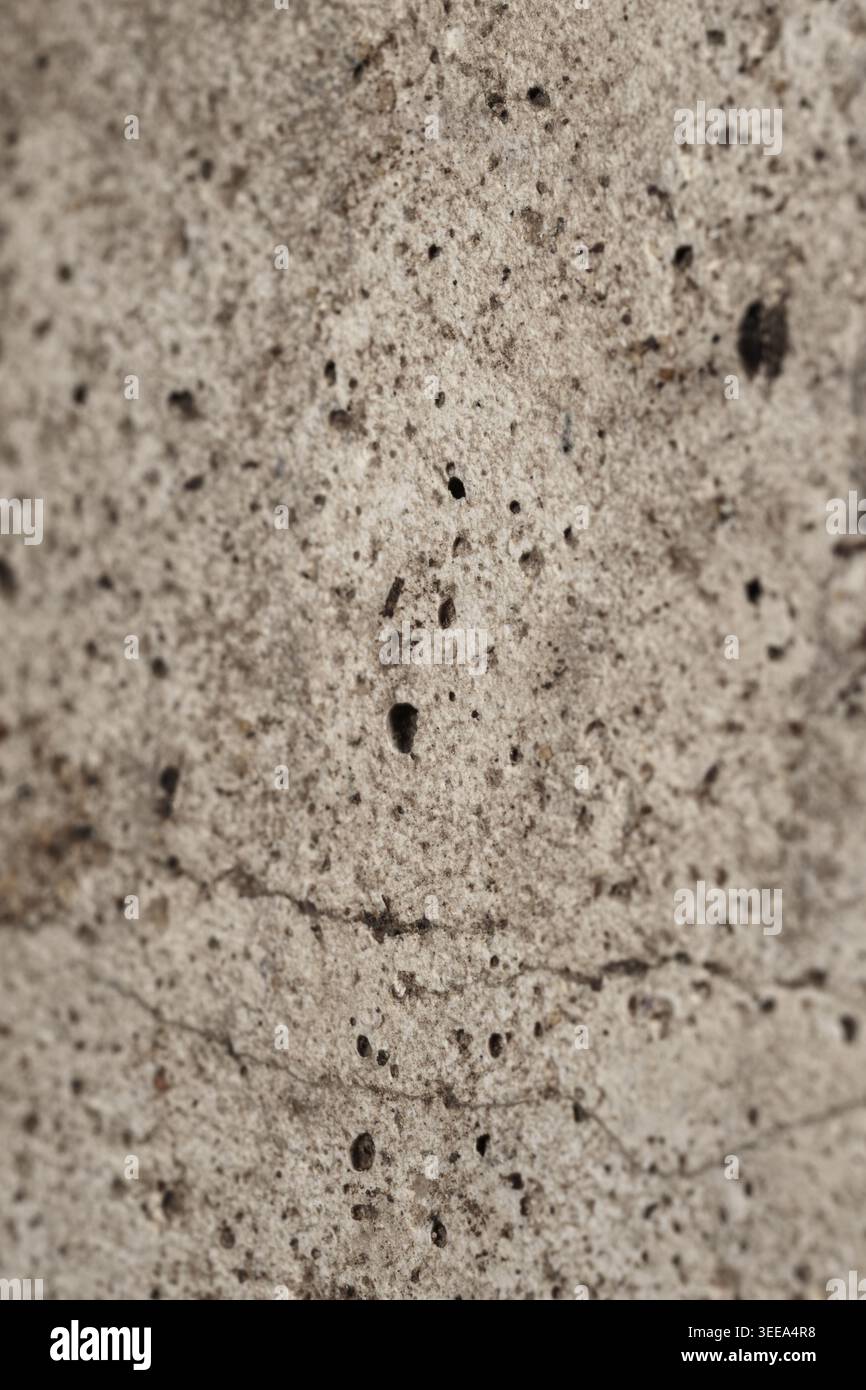 Close-up texture of weathered limestone wall surface Stock Photo