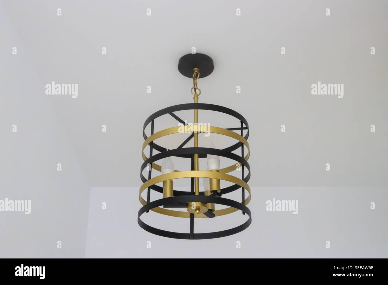 Indoor pendant electric lamp fixed a white ceiling Stock Photo
