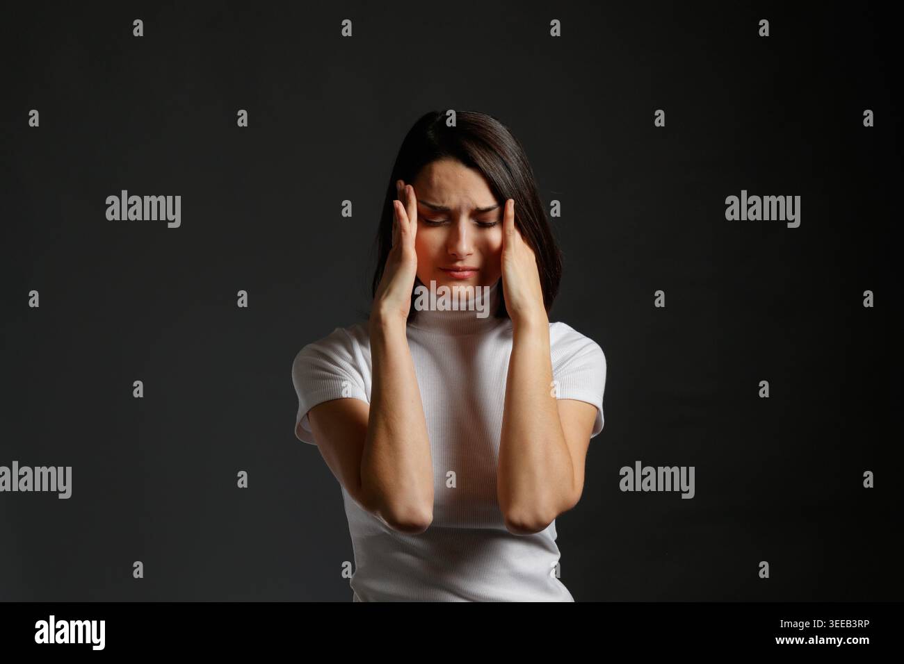 Woman suffering from intense headache Stock Photo
