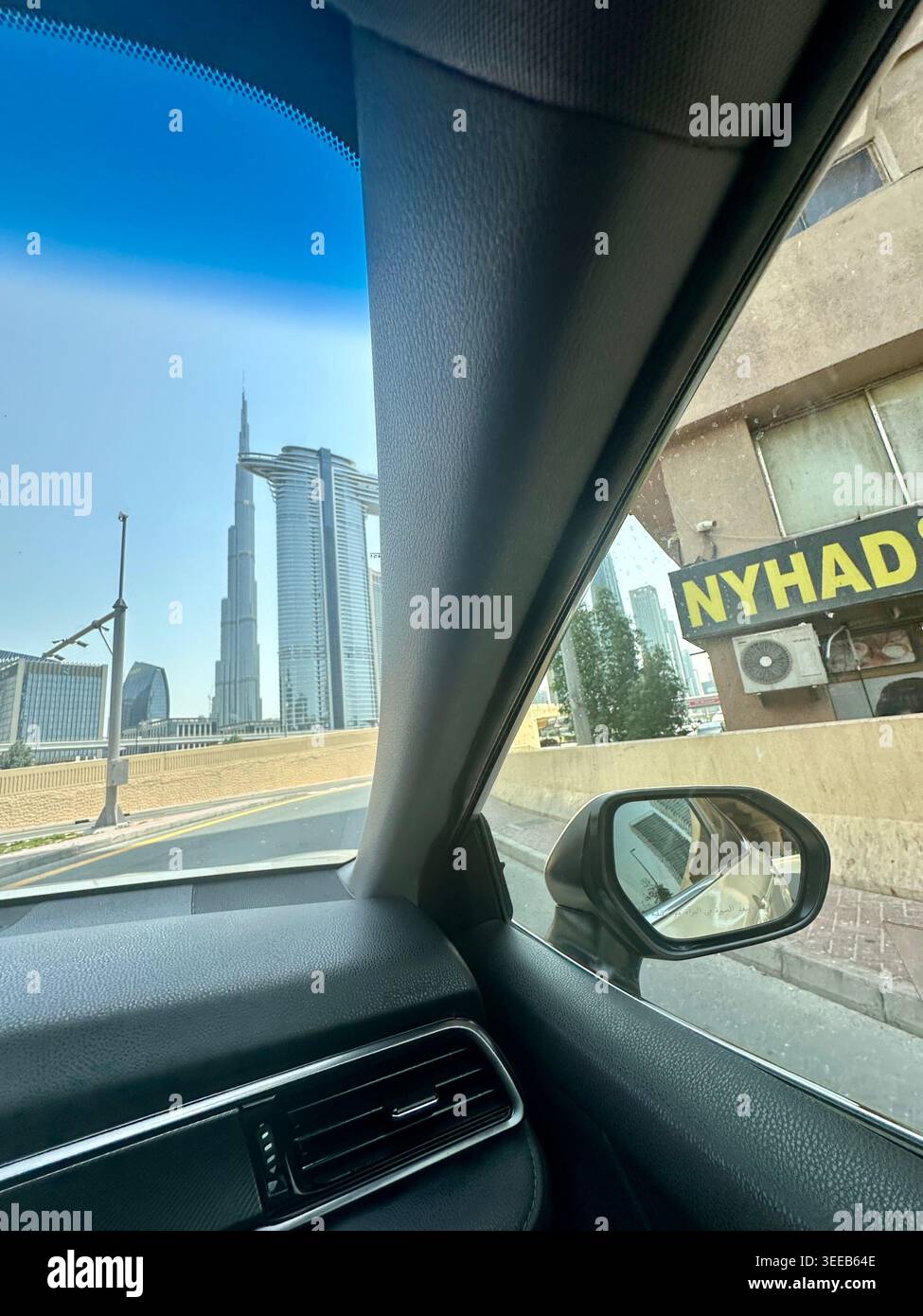 authentic drive by shot of dubai Burj khalifa from inside a taxi Stock Photo