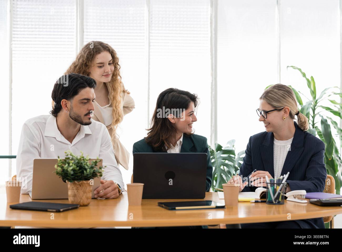 Diverse business team collaborating during office meeting Stock Photo