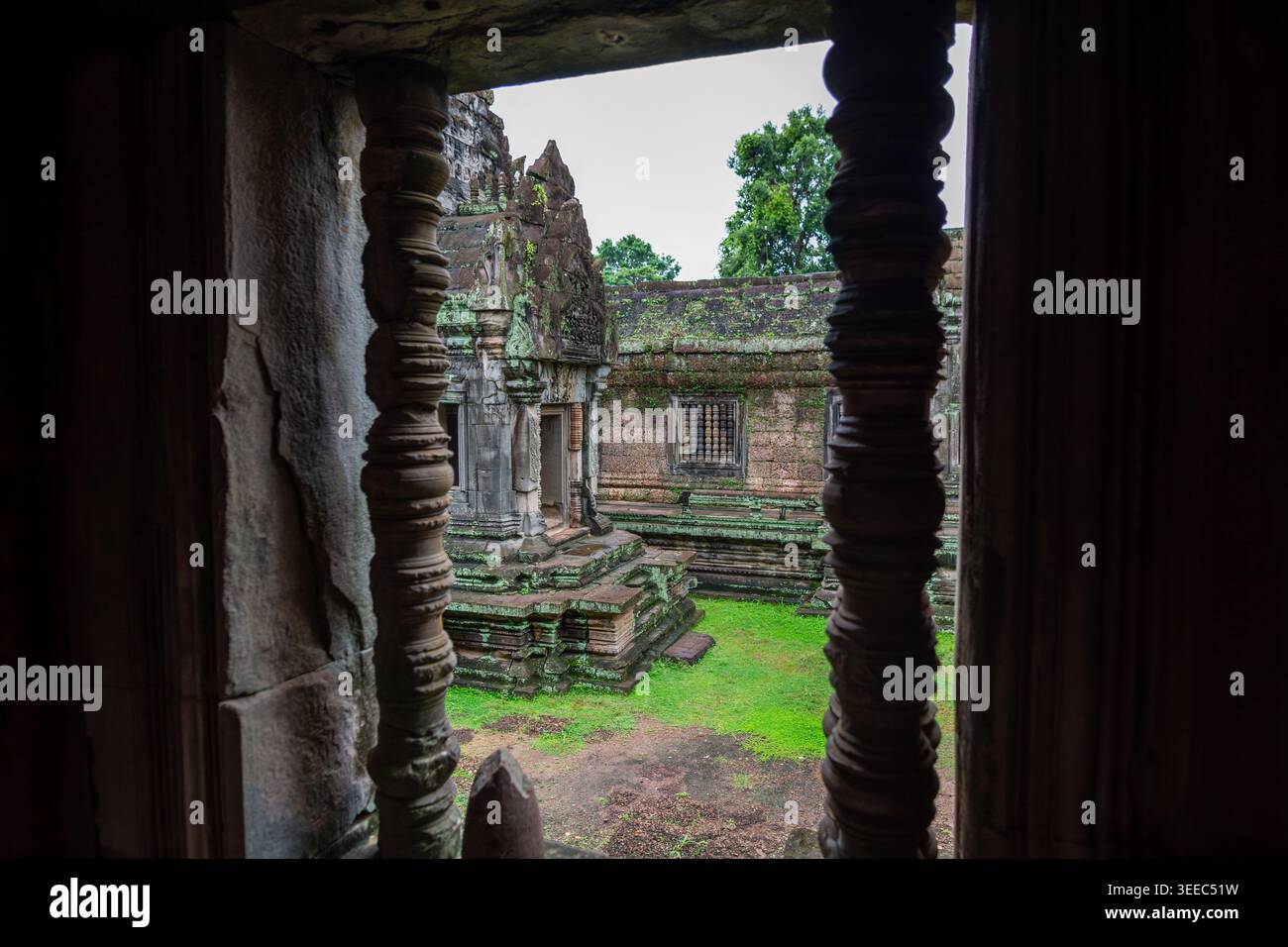 An evocative glimpse of Banteay Samre temple framed by iconic Khmer ...