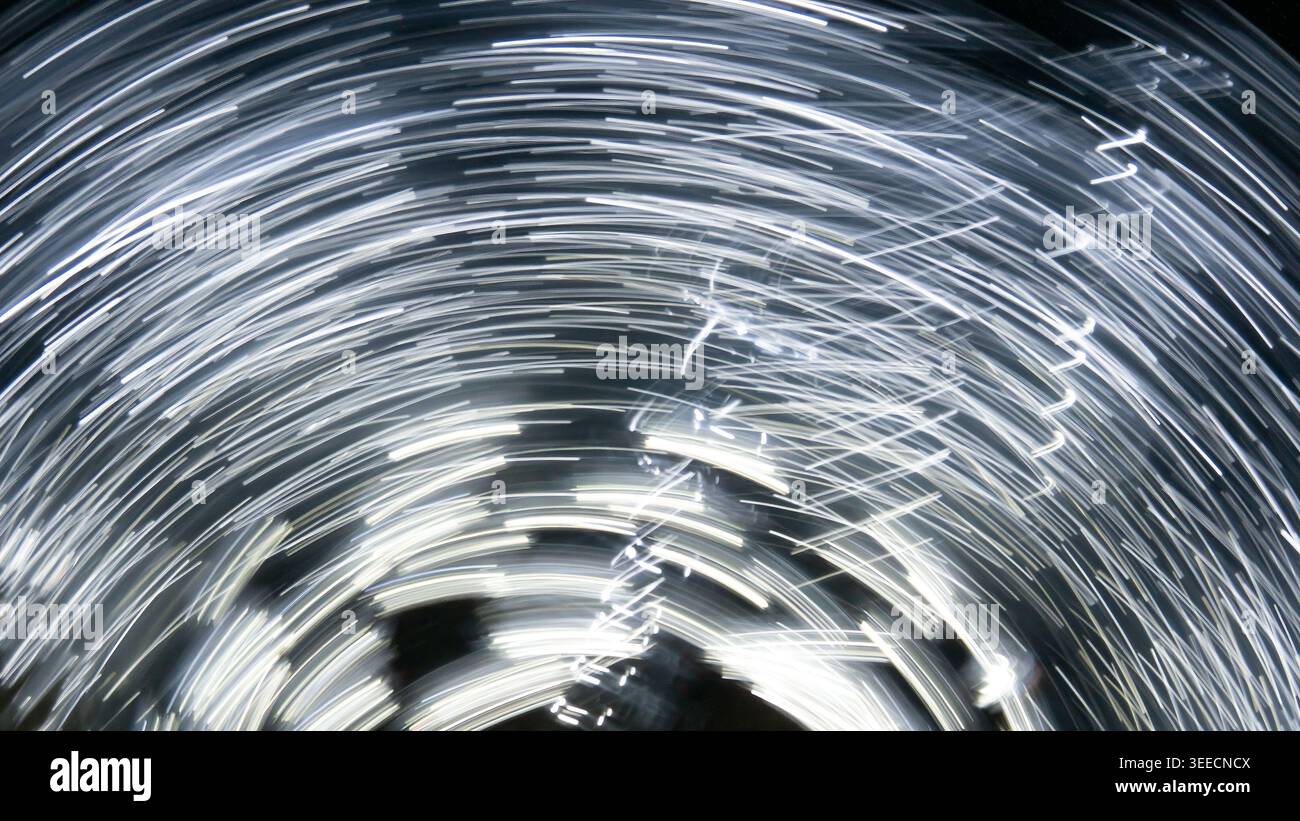 Abstract Long Exposure Light Trails Spinning Vortex Movement Stock Photo