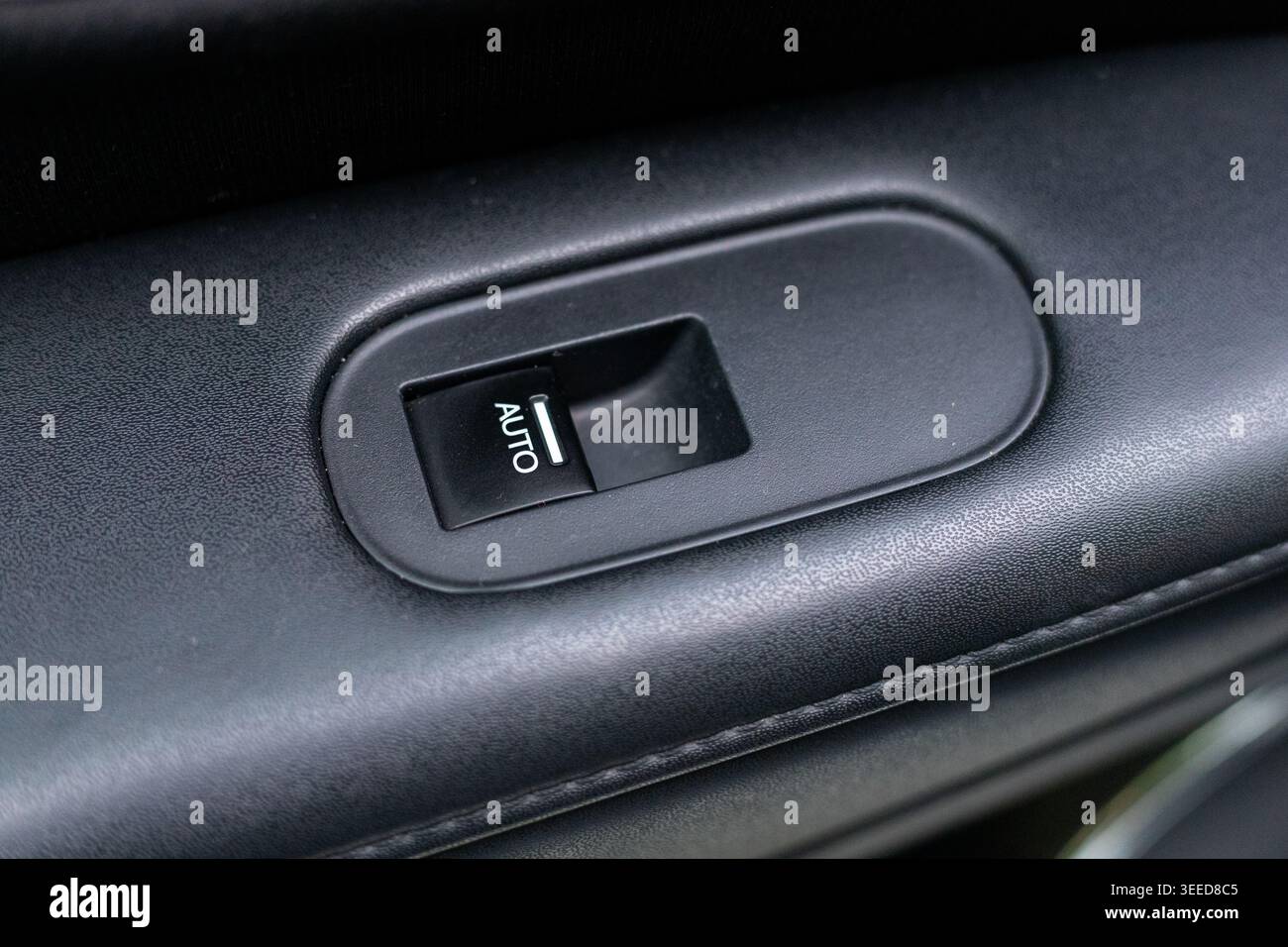 Closeup of a Window Control Button in Automatic Car Stock Photo