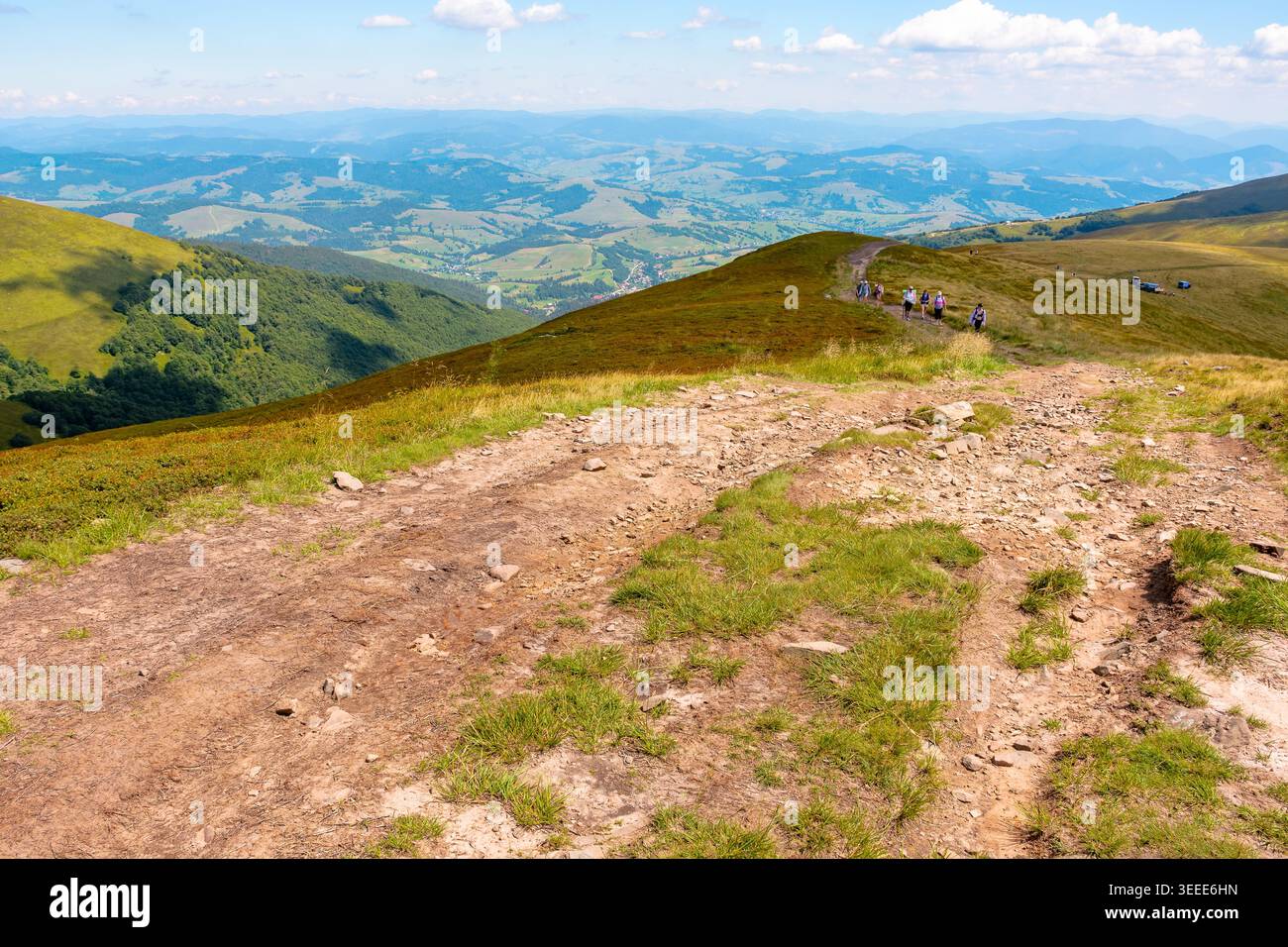 summer landscape. mountain path through the grassy slope turns uphill to the sky. scenic view. hiking trail path through borzhava ridge. travel ukrain Stock Photo