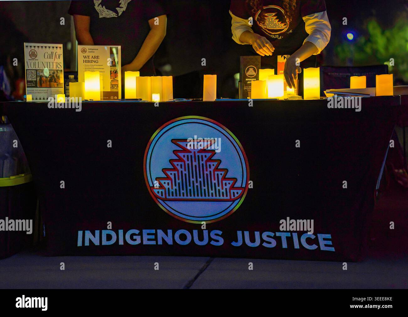 An Indigenous Justice information booth illuminated by candles at an ...