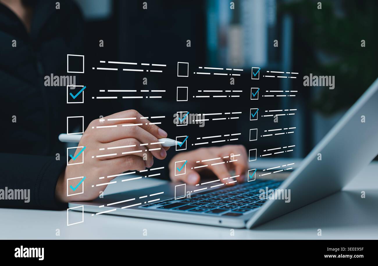 Digital checklist form and online survey task management concept. Person using laptop with check boxes, completed tasks, workflow approval, compliance Stock Photo