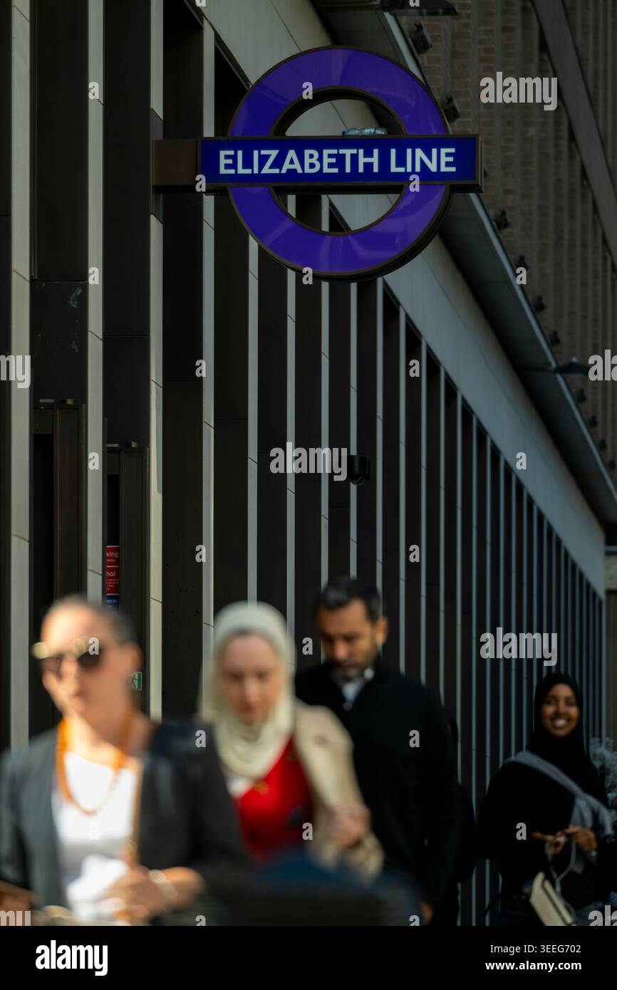People walking beneath Elizabeth Line signage at Bond Street station in ...
