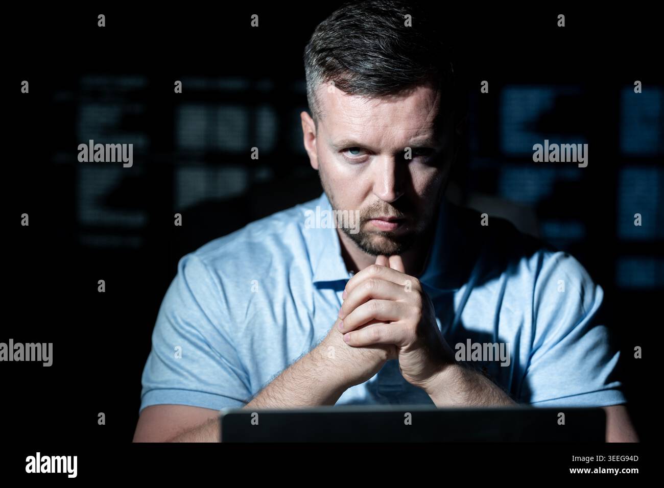 Network security specialist uses laptop. Network security specialist monitors cyber attack. Network security specialist analyzes code screen. Network Stock Photo