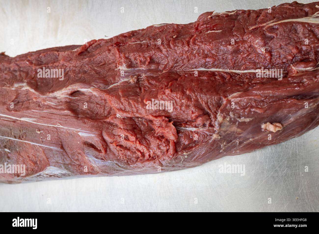 Macro shot of a fresh raw beef tenderloin piece showing muscle fiber ...