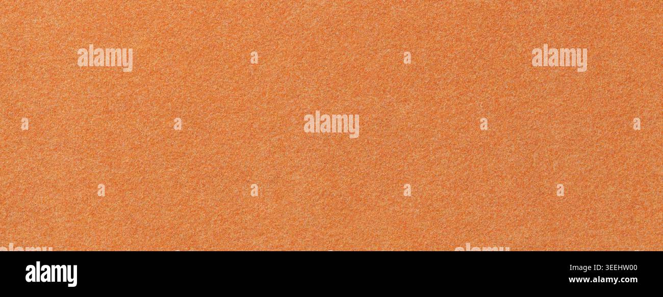 Orange suede fabric background with matte microfiber texture, soft apricot felt surface, macro. Stock Photo